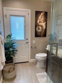 Updated bathroom with modern fixtures and glass shower