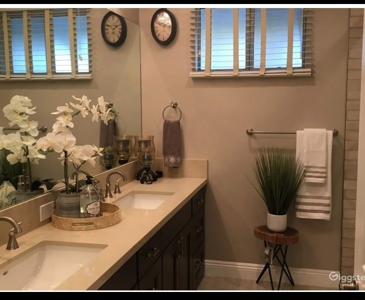 Master bathroom with double vanity and walk-in glass shower